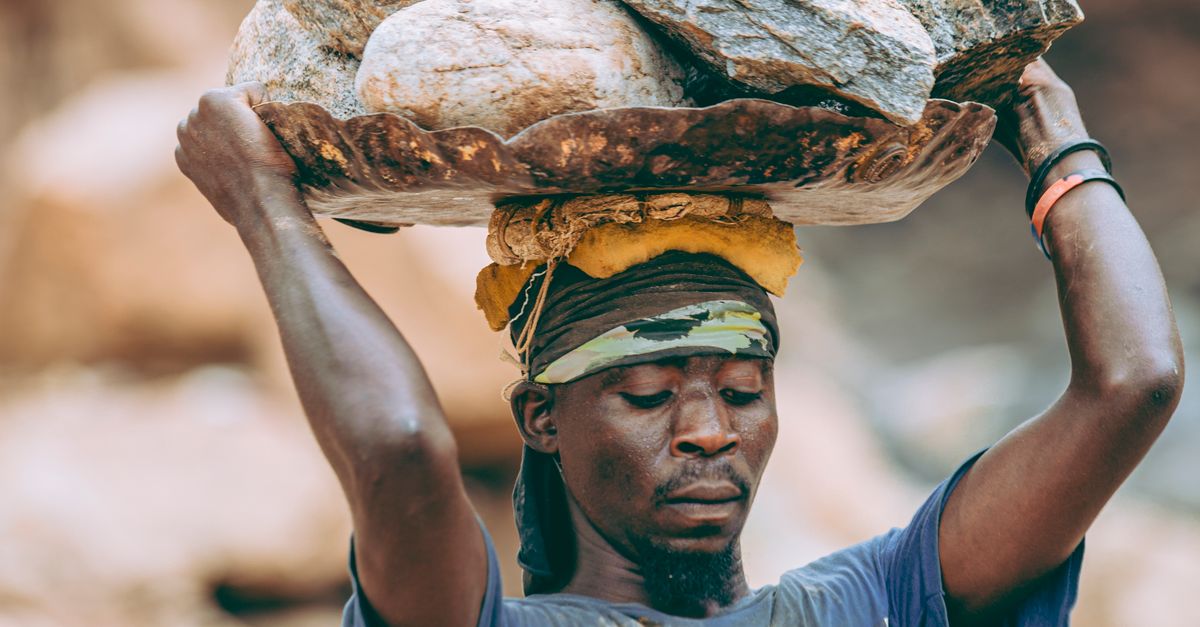 Workers Carrying Rocks Laborer Carrying Heavy Rocks Outdoors · Free Stock Photo