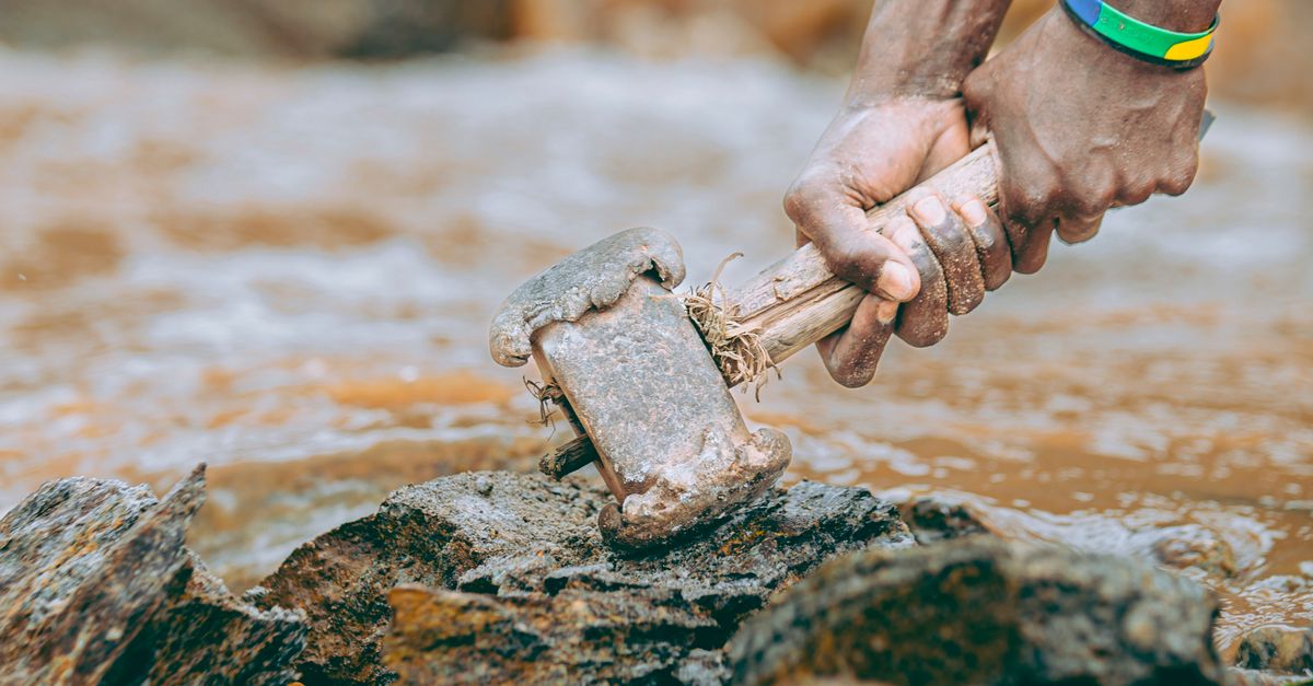 Human Breaking Rocks Worker Breaking Rock with Hammer Outdoors · Free Stock Photo