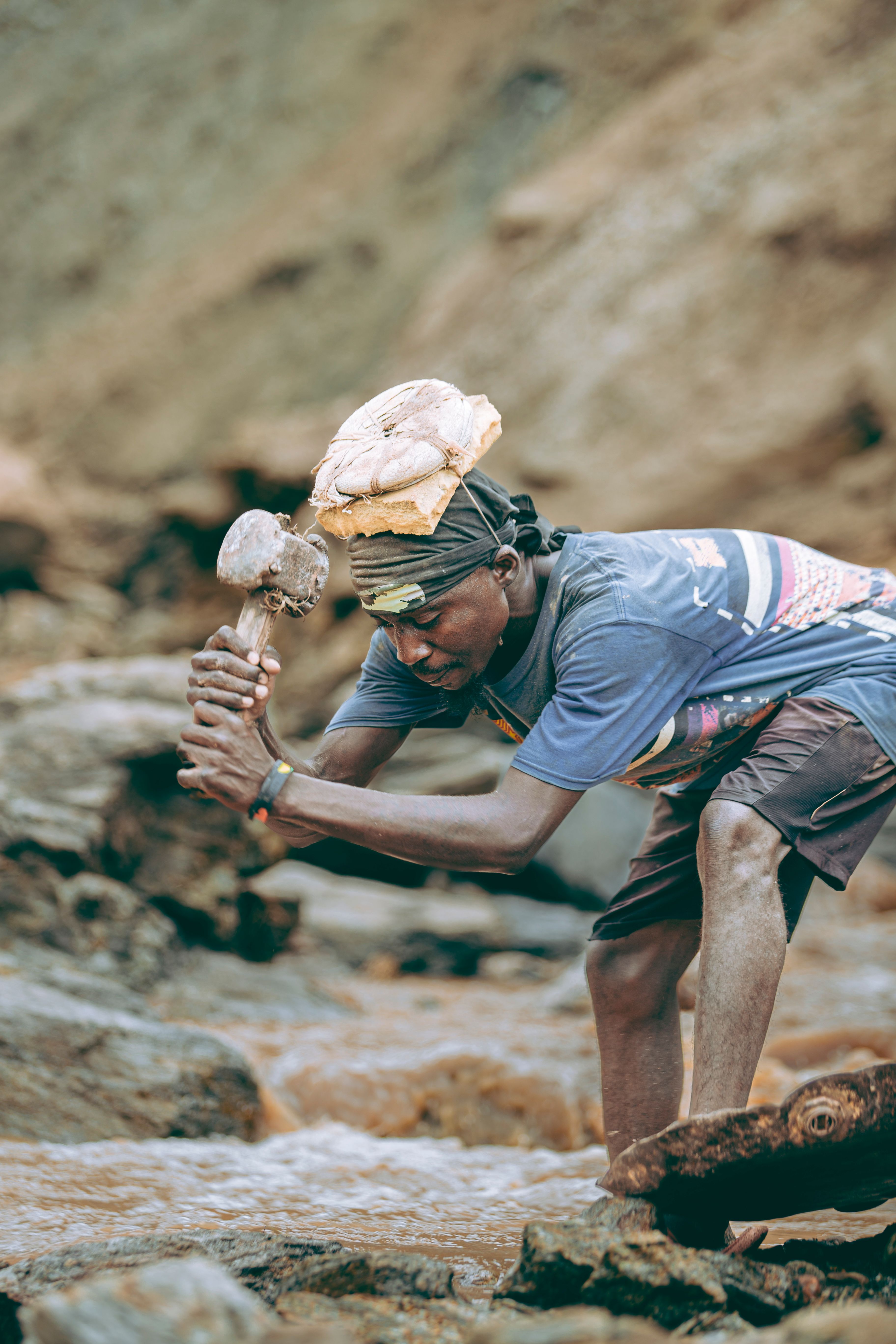 Man Mining in Rocky Stream Outdoors · Free Stock Photo