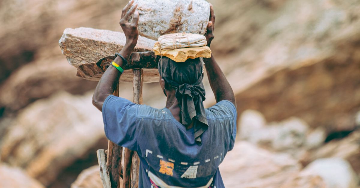 Workers Carrying Rocks Worker Balancing Rocks in Quarry Landscape · Free Stock Photo