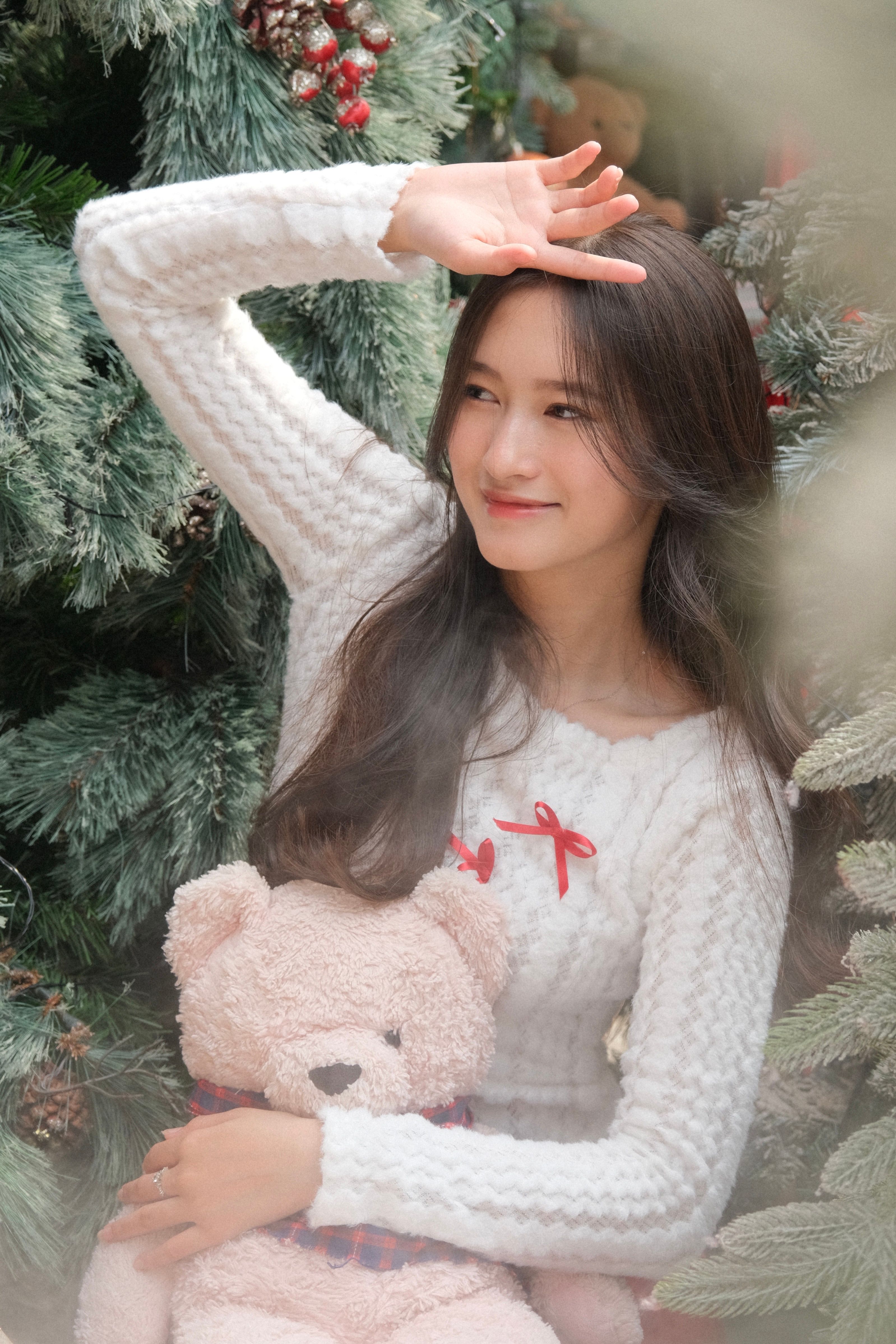 Young Woman Enjoying Winter with Teddy Bear