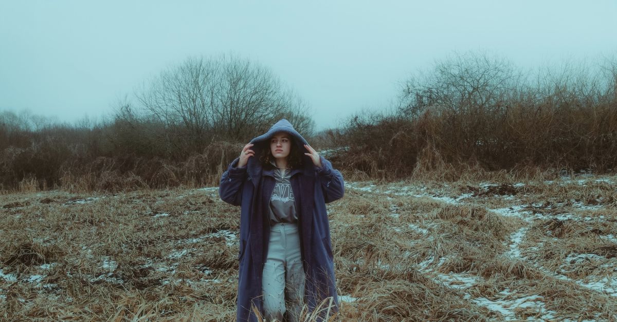 Sparse Snow Woman Standing in Winter Field with Sparse Snow · Free Stock Photo