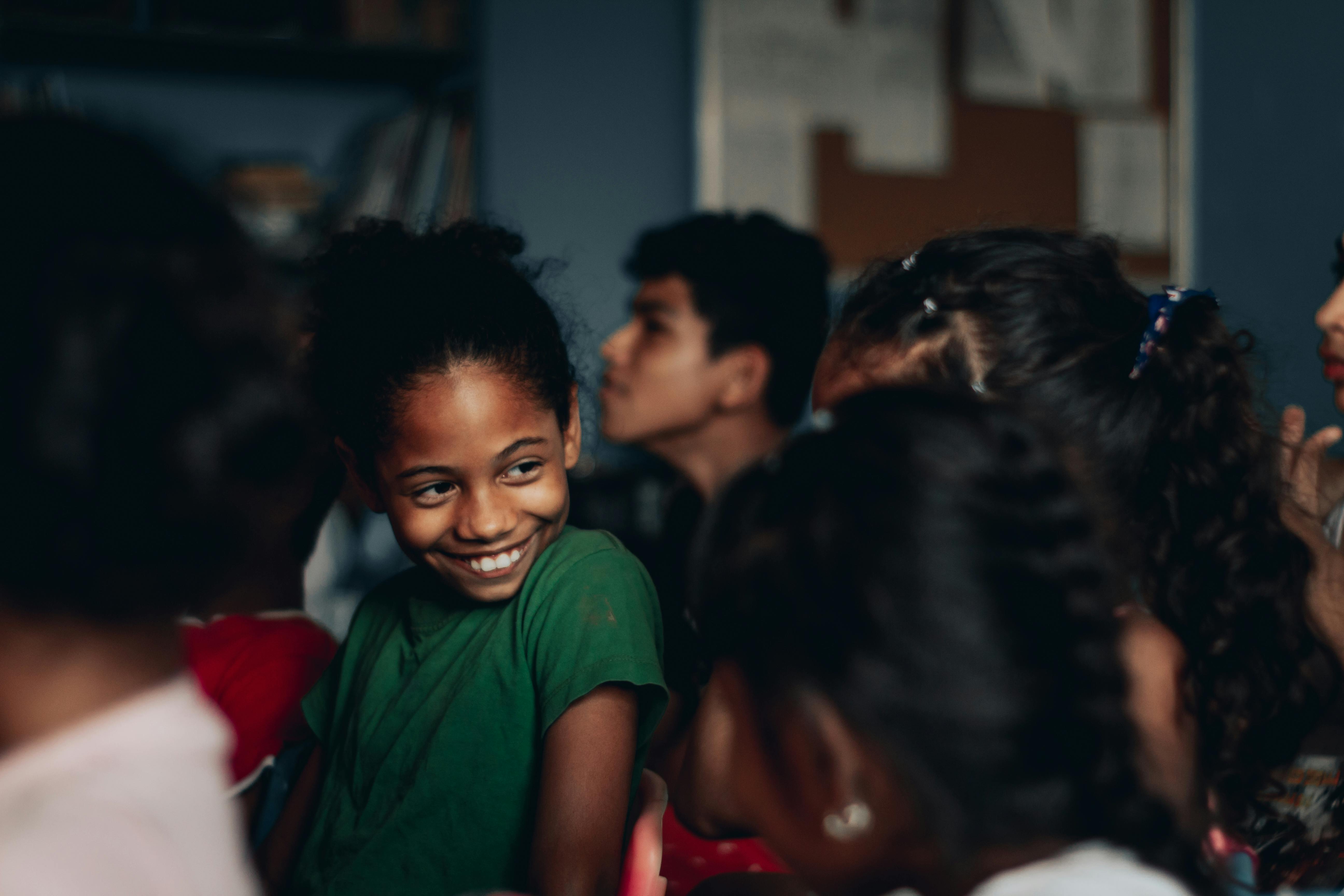 black smiling girl with friends during theater performance