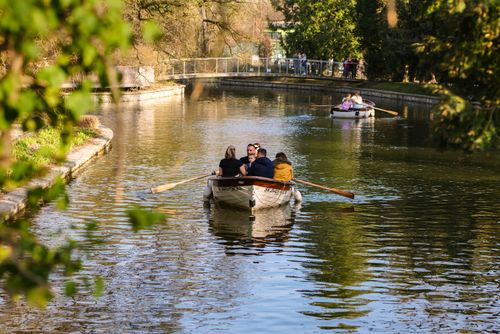 Free People enjoying a relaxing day rowing boats on a calm canal in Zagreb, Croatia. Stock Photo