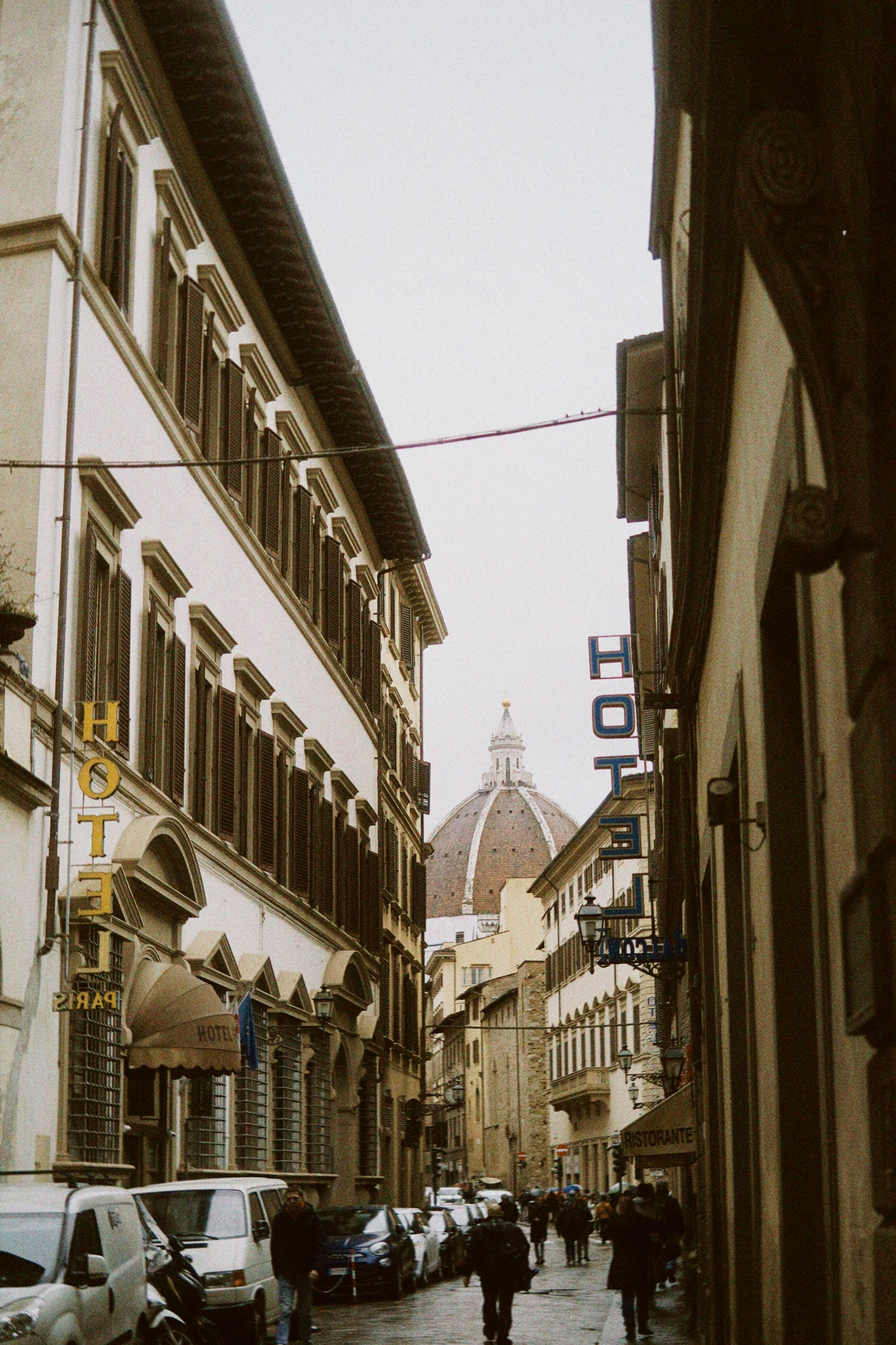 Charming Florence alleyway with view of the iconic Duomo dome, Italy.