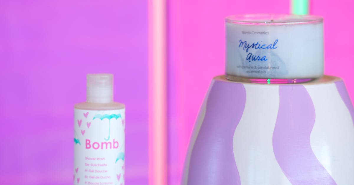 A woman testing different moisturizers on her hand in a cosmetic store.