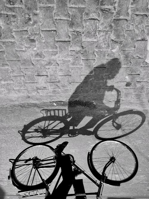 Person's Shadow Riding Bicycle