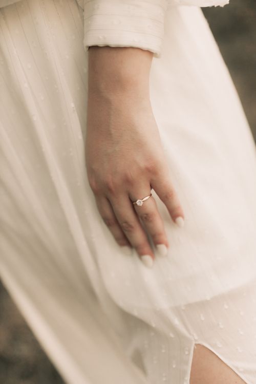 Free Close-up of a bride's hand with an elegant engagement ring on her finger. Stock Photo