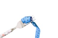 Fork with Measuring Tape: Diet Concept Image