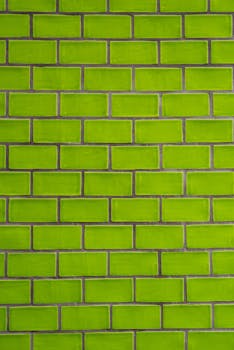 Bright green brick wall texture useful for backgrounds and design projects.