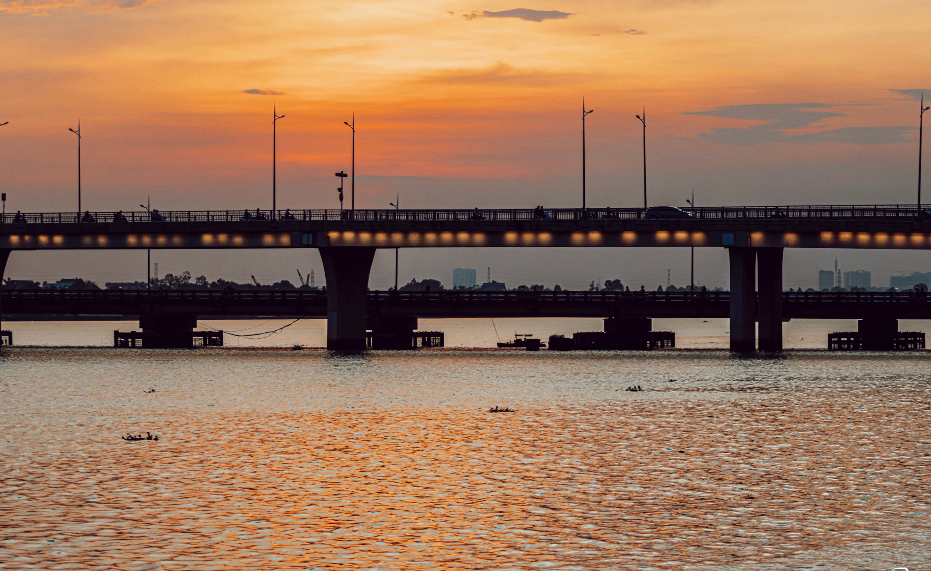 Marine Drive promenade in Ernakulam with the Rainbow Bridge at sunset