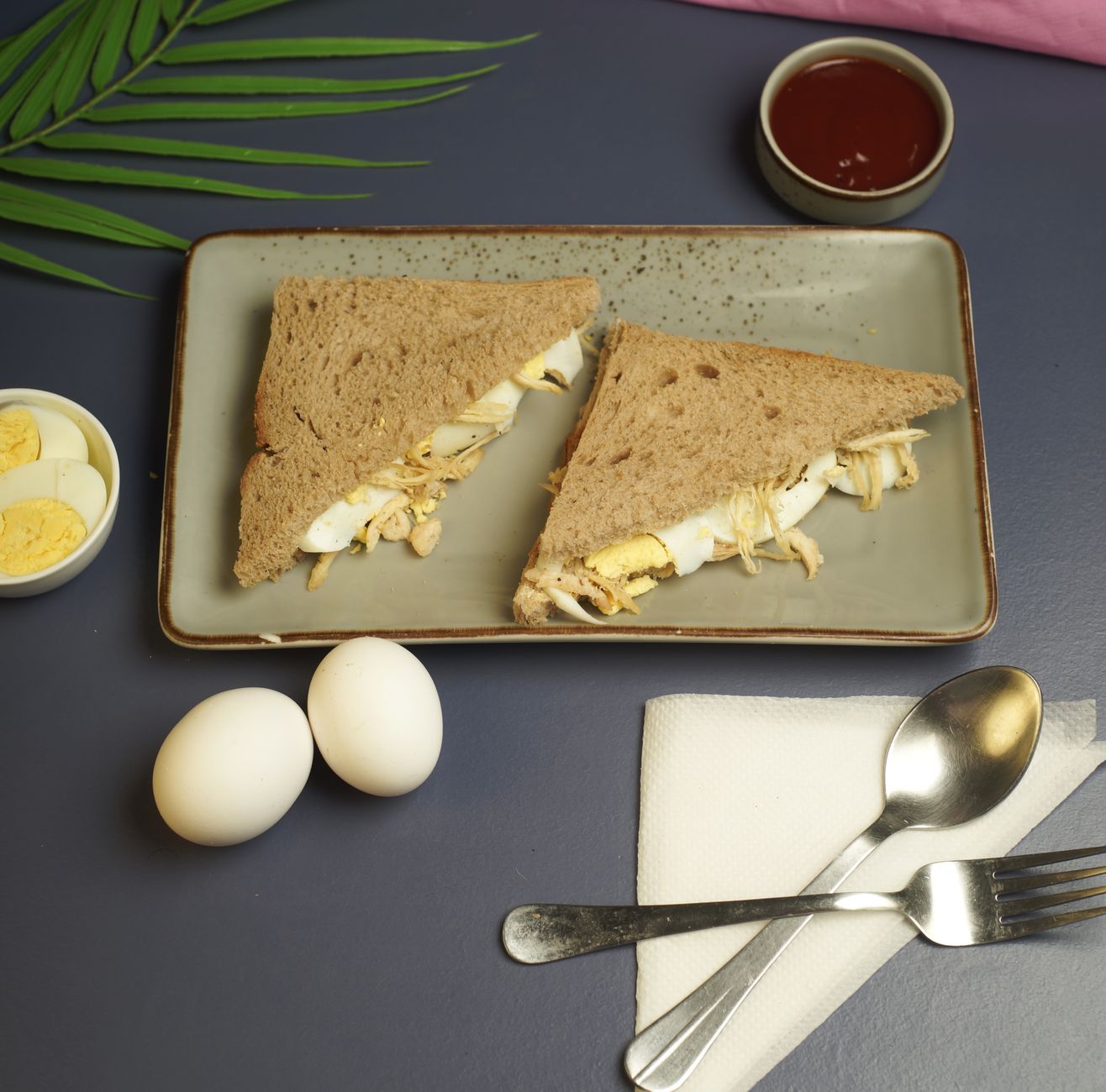 Top 10 Keto Meals for Busy Weeknights 1 Tasty egg sandwich with sliced boiled eggs served on a ceramic plate.