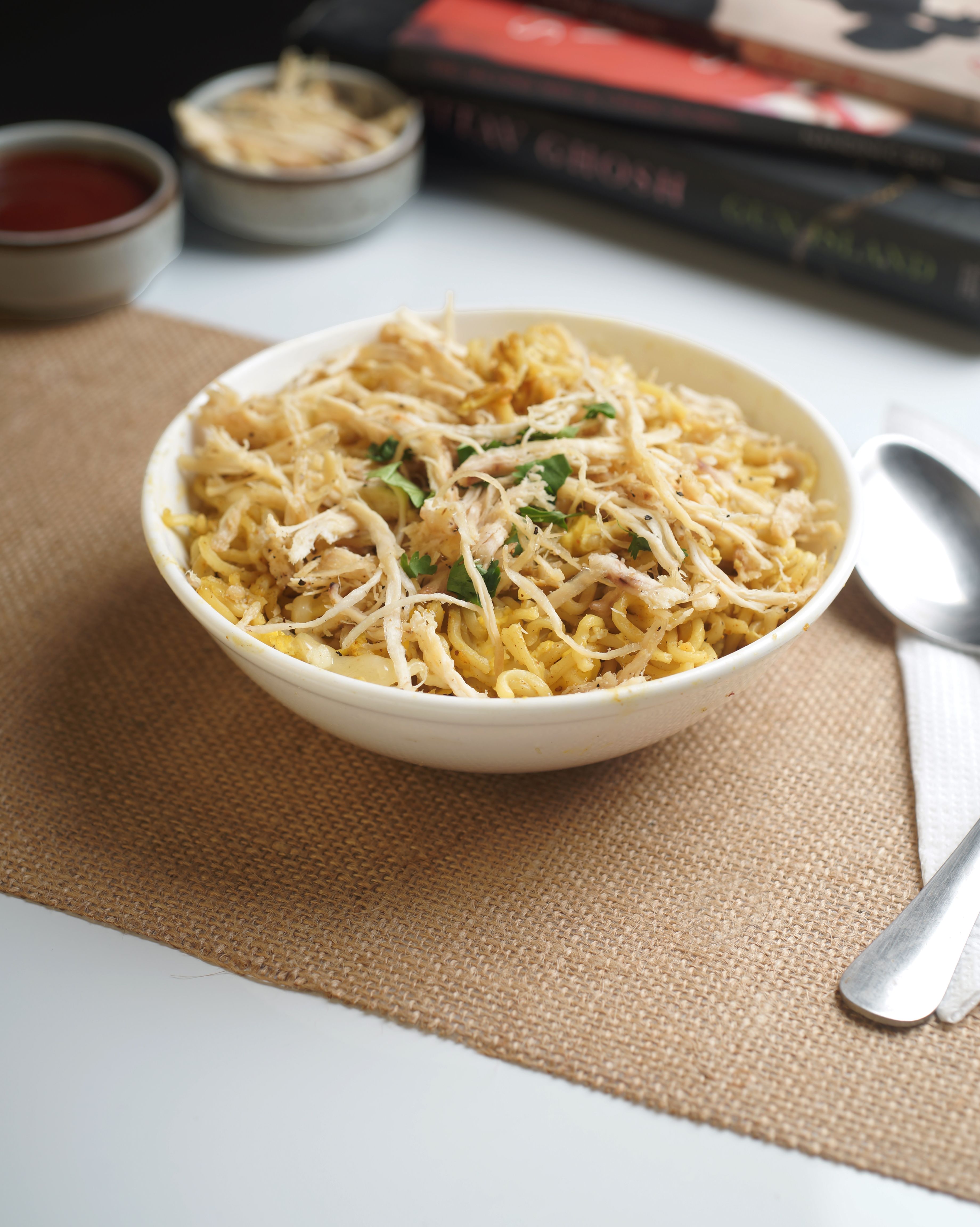delicious chicken noodles in white bowl