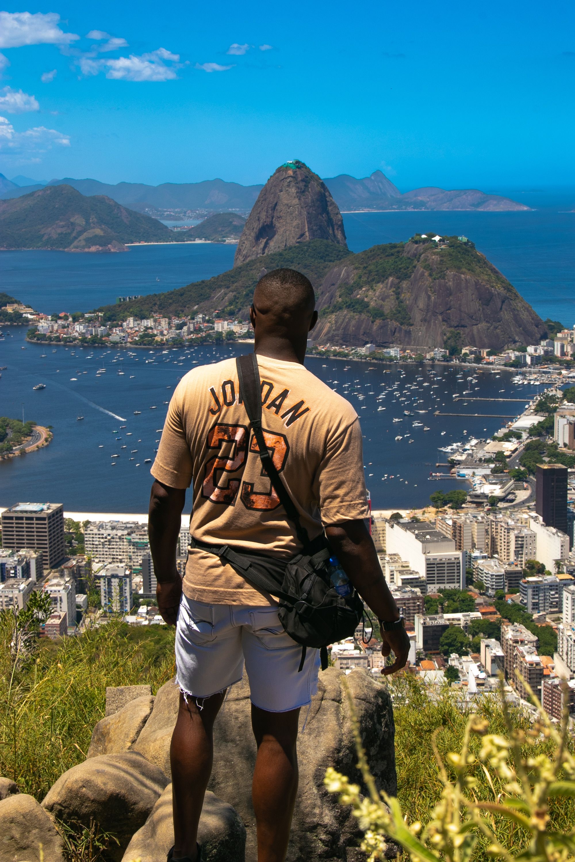 Man Overlooking Rio de Janeiro from Mountaintop · Free Stock Photo