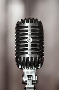 Vintage microphone with a classic retro design, perfect for music and broadcasting themes.