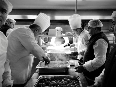 Chefs at work in a bustling kitchen in Istanbul, creating culinary magic in black and white.