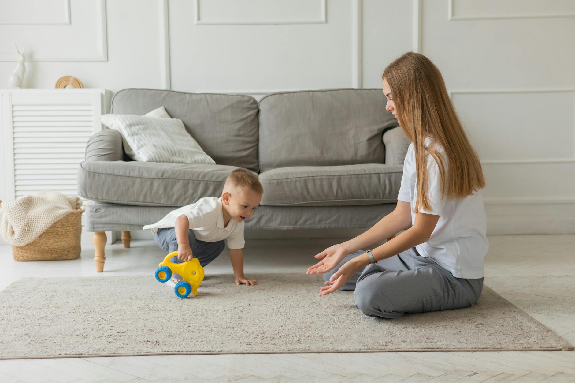 Child Expressing Anger In A Cozy Living Room Setting, With Toys Scattered Around And A Parent Listening Empathetically