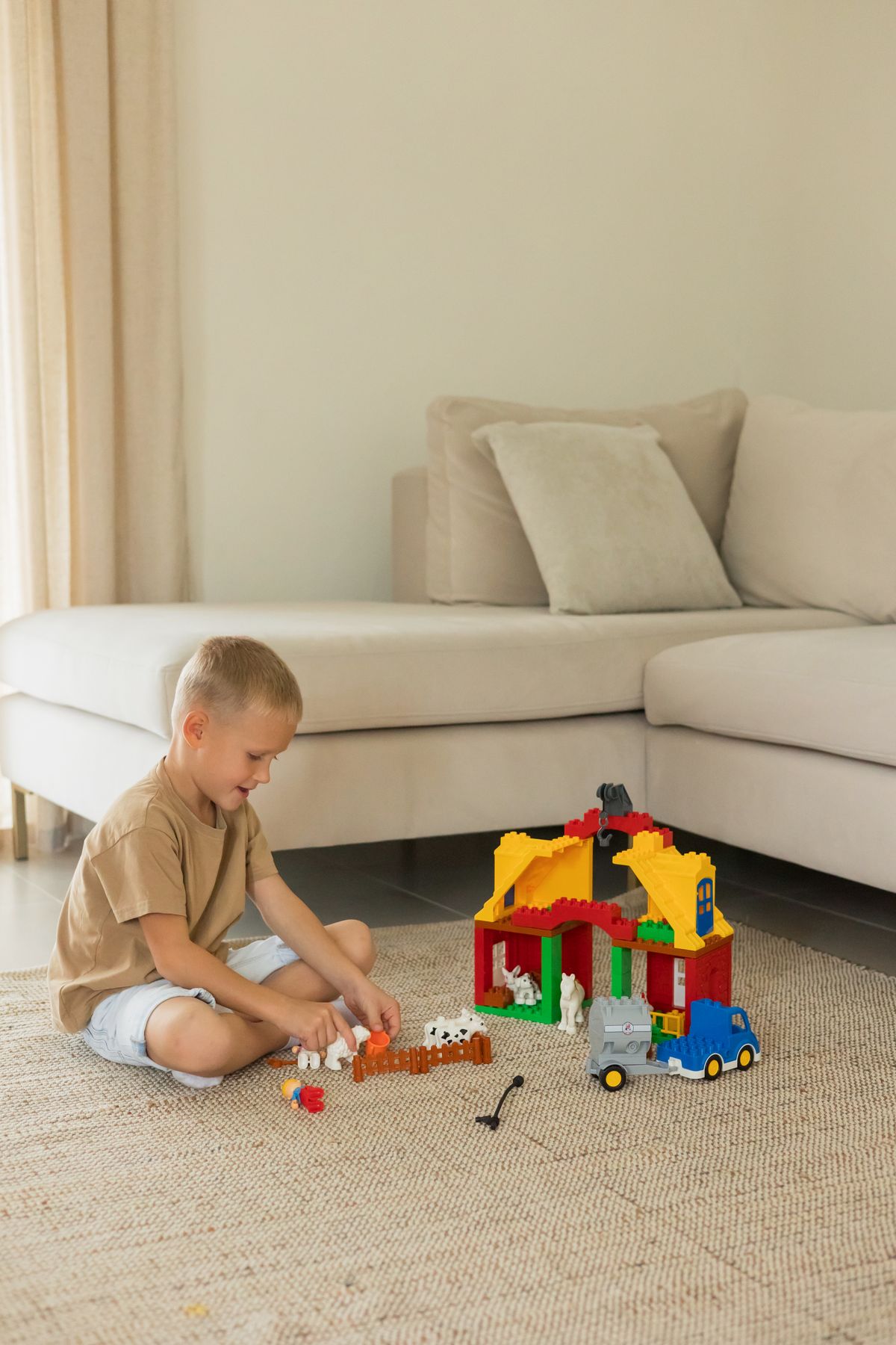 Young child building with colorful toys