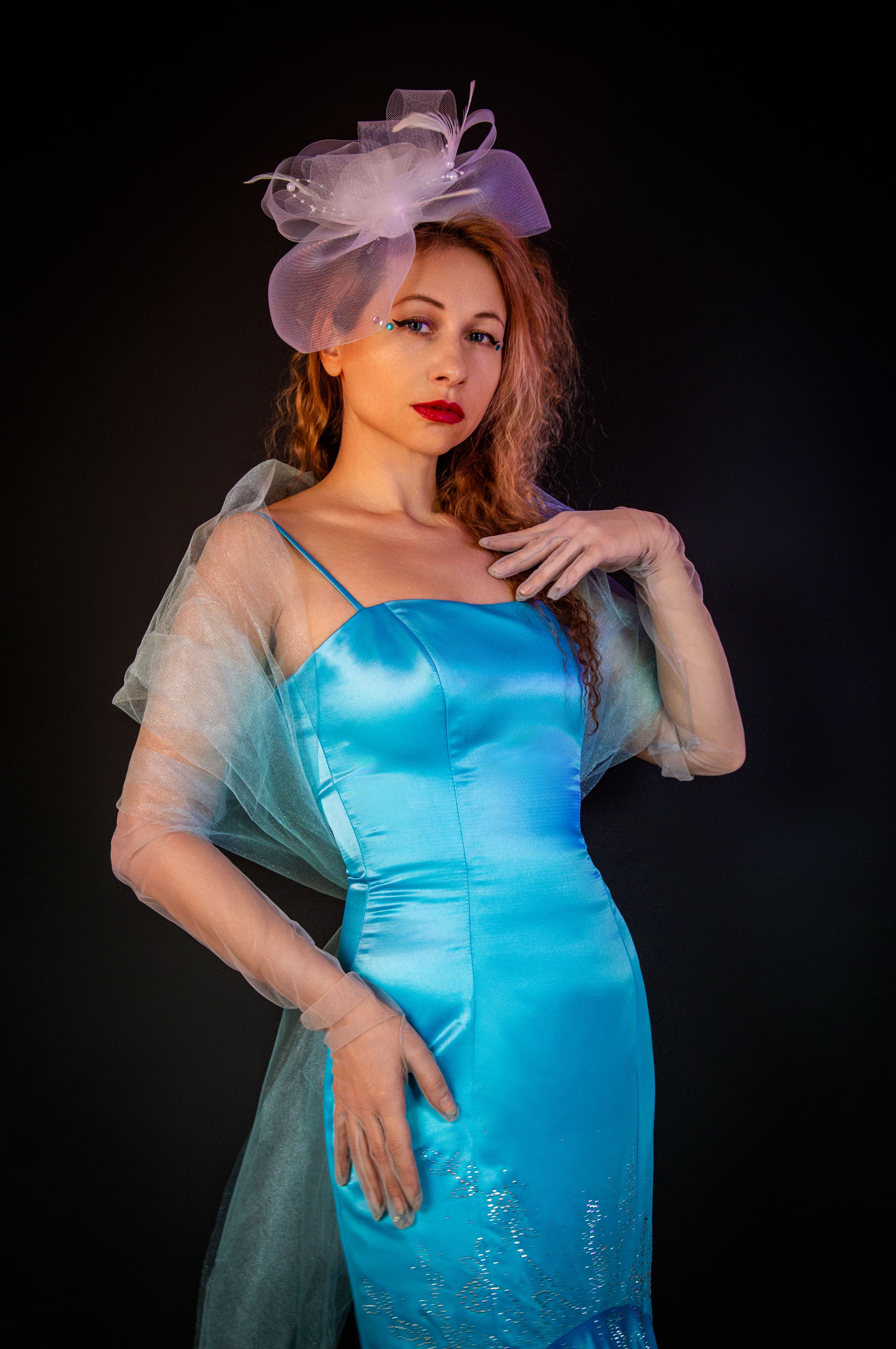 Elegant Woman in Blue Evening Dress and Hat · Free Stock Photo