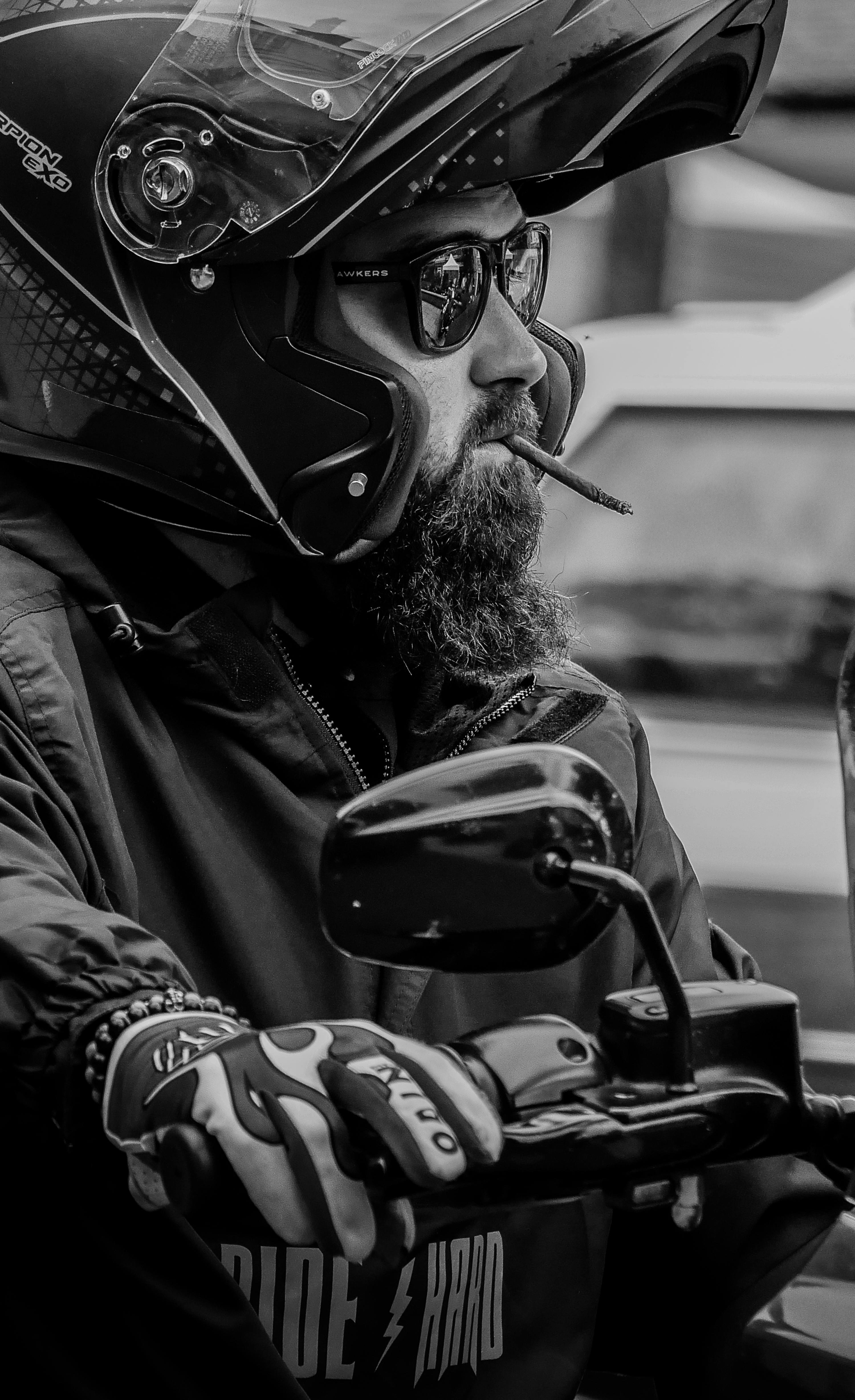 Bearded biker with helmet riding in Saint-André-de-l'Eure, Normandie, France.