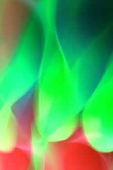 Vibrant abstract design with flowing green and red lights, creating a dynamic visual effect.