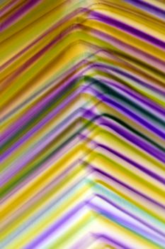 Colorful abstract image of overlapping diagonal lines creating a dynamic pattern.