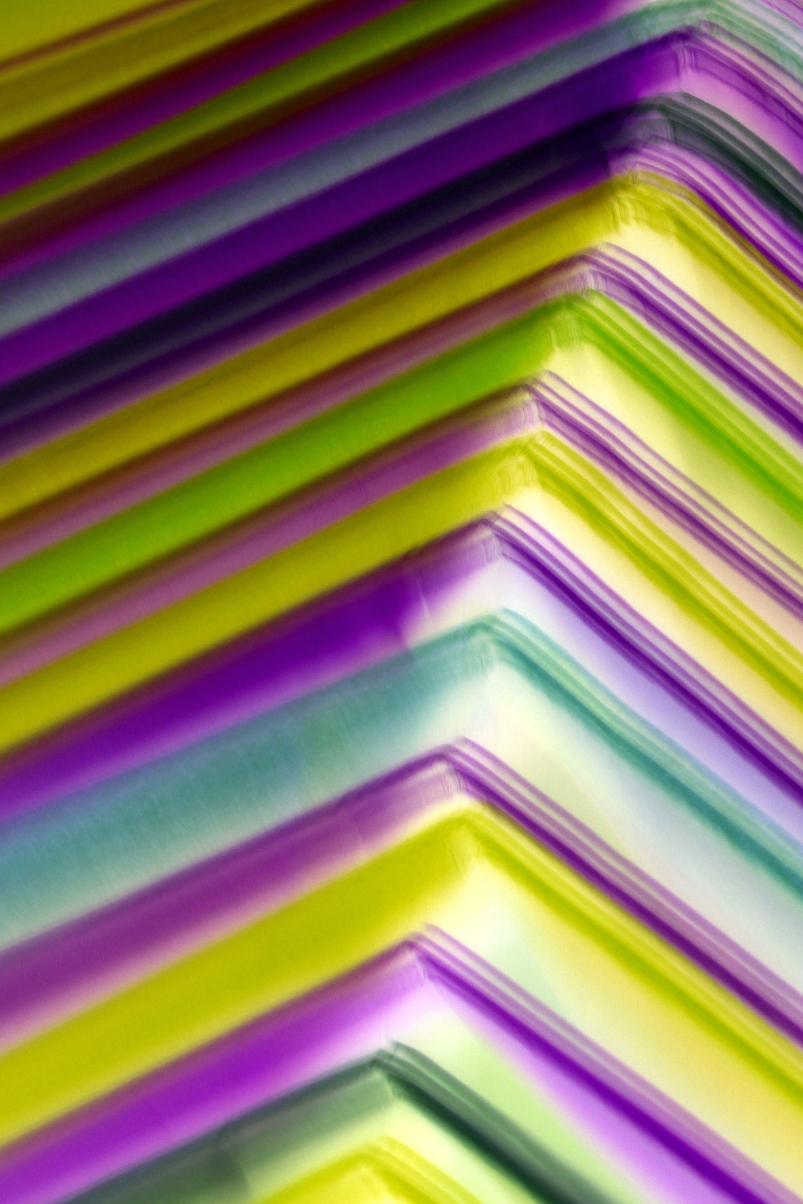 Vibrant abstract image featuring colorful paper stacks with gradient light effects creating a dynamic visual.