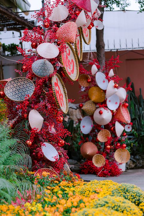 Free Colorful Asian-inspired outdoor decoration with baskets and flowers. Stock Photo