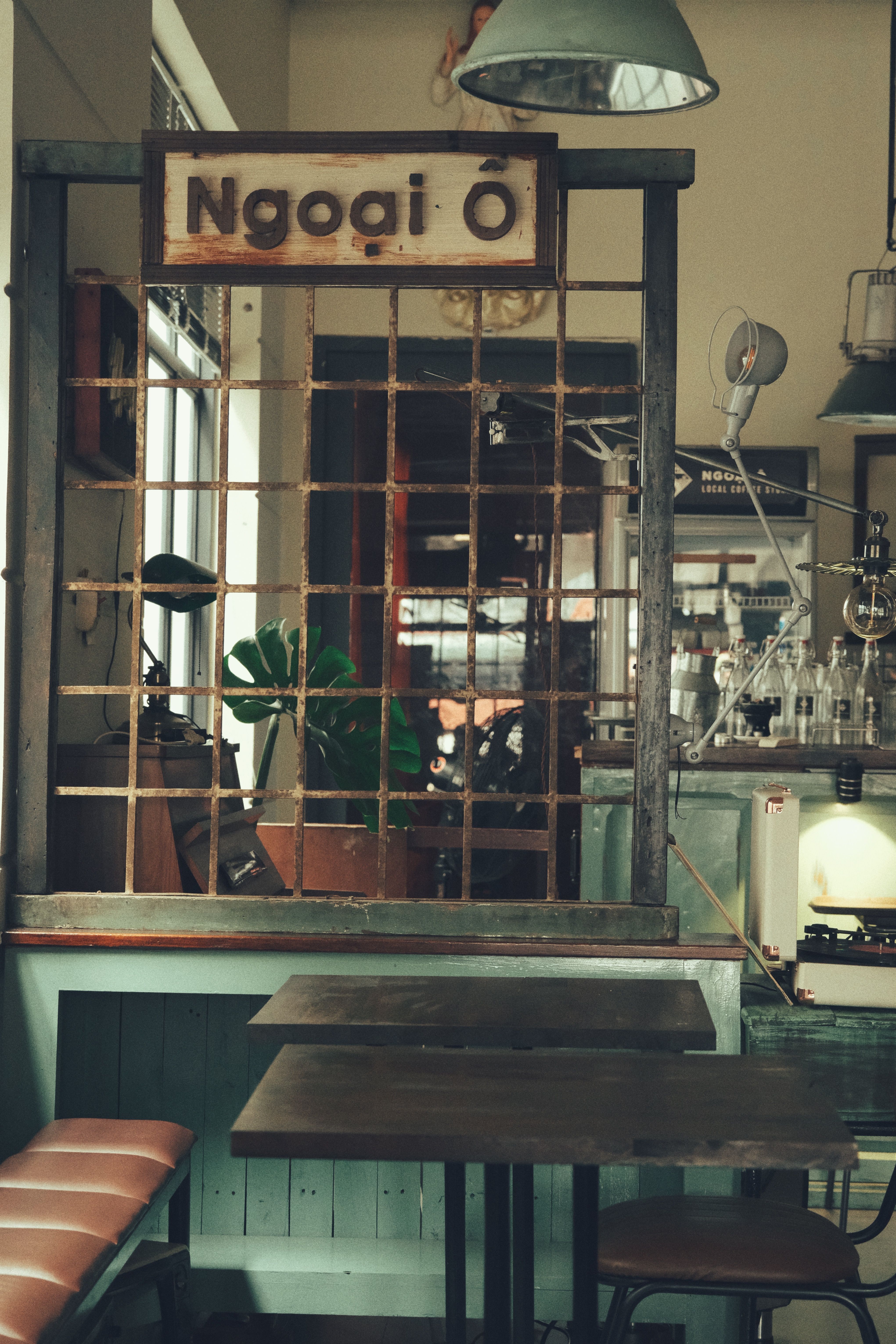 A charming vintage café interior with rustic wooden furniture and classic decor, creating a warm ambiance.
