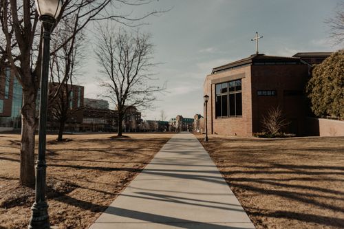 Free A serene view of a church and walkway on a crisp spring day in Milwaukee. Stock Photo