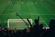 Exciting Football Match with Enthusiastic Fans