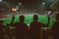 Energetic Football Match with Enthusiastic Fans