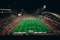 Aerial View of a Night Football Match in Stadium