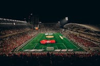 Vibrant Nighttime Football Match at Zayed Stadium