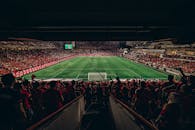 Vibrant Football Match Atmosphere in Full Stadium