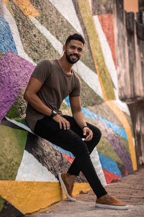 Man in Brown Crew-neck T-shirt and Black Denim Jeans