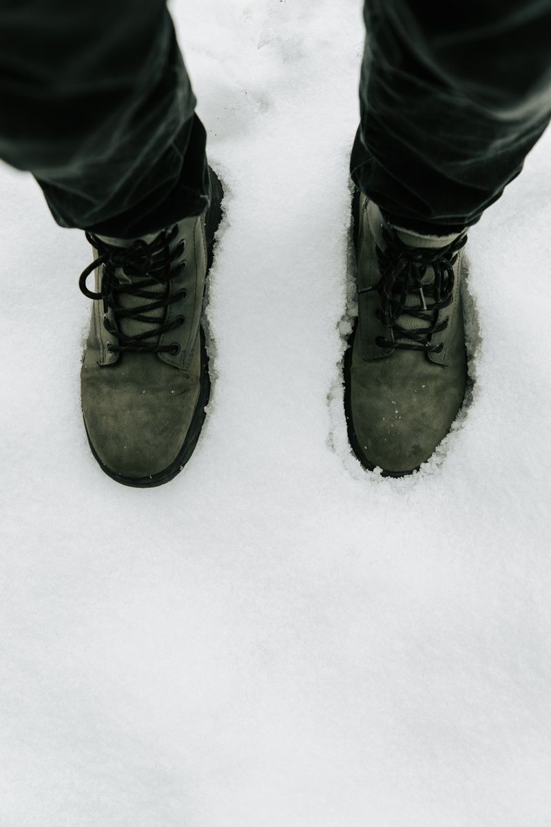 Winter boots in snowy landscape
