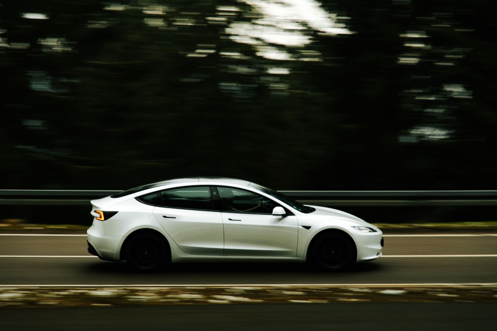 Electric car driving on a road