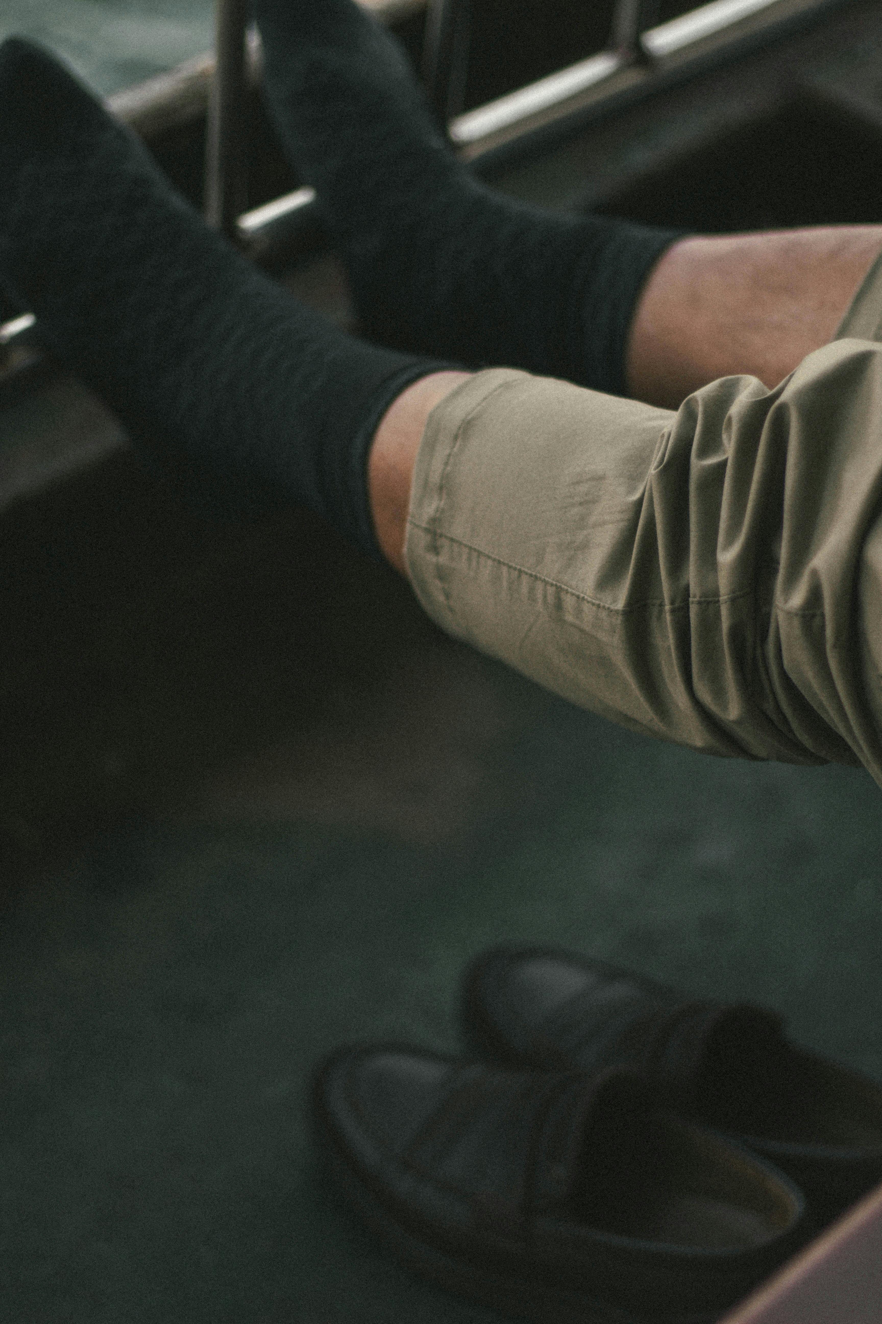 Casual moment on a boat in Istanbul with legs resting on a railing, capturing leisure and calm.