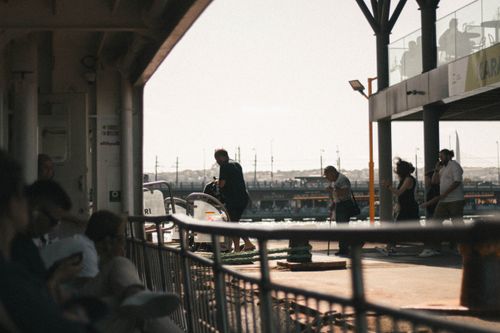 Free People at an Istanbul ferry dock, capturing daily life and travel in the city. Stock Photo