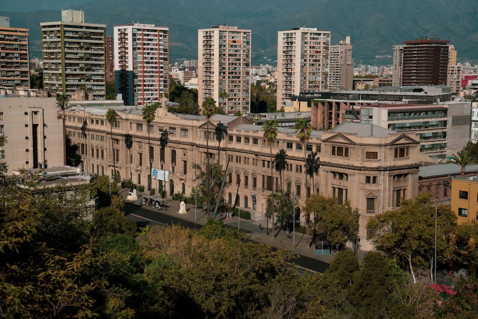 A historic building in Santiago, Chile with a backdrop of modern high-rise buildings.