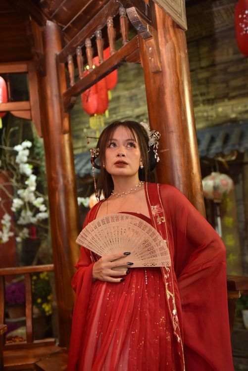 Elegant Woman in Traditional Red Dress with Fan · Free Stock Photo