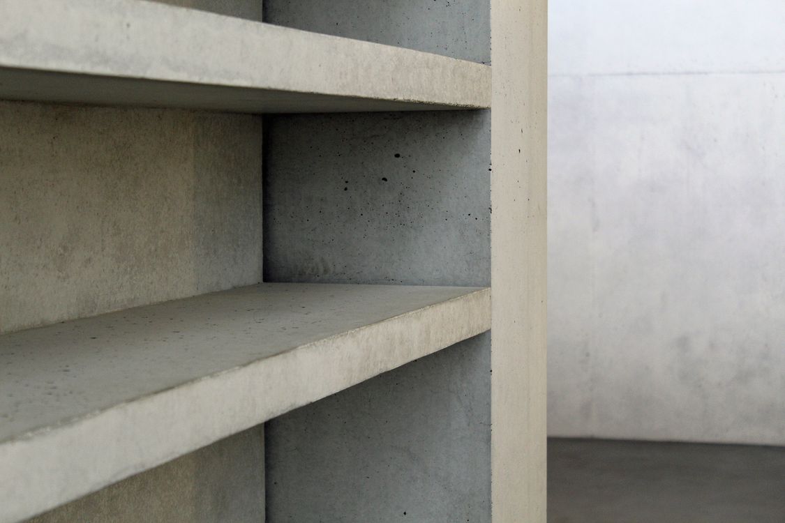 Concrete Storage Racks Modern Concrete Shelving in Minimalist Setting · Free Stock Photo