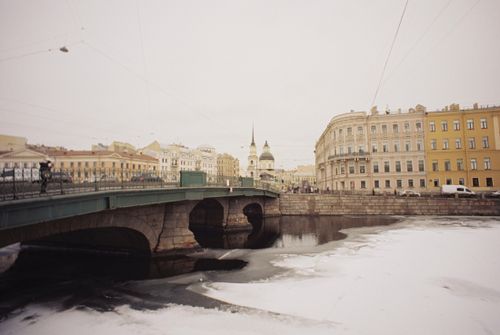 Free Historic buildings along Fontanka River with a wintery bridge view. Stock Photo