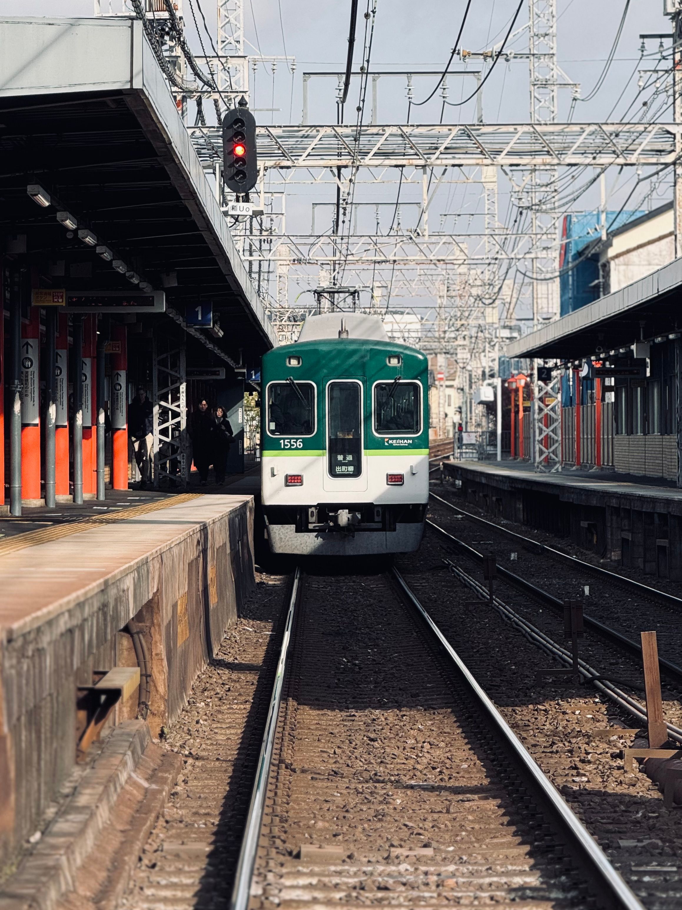Urban Train Approaching a Japanese Railway Station · Free Stock Photo