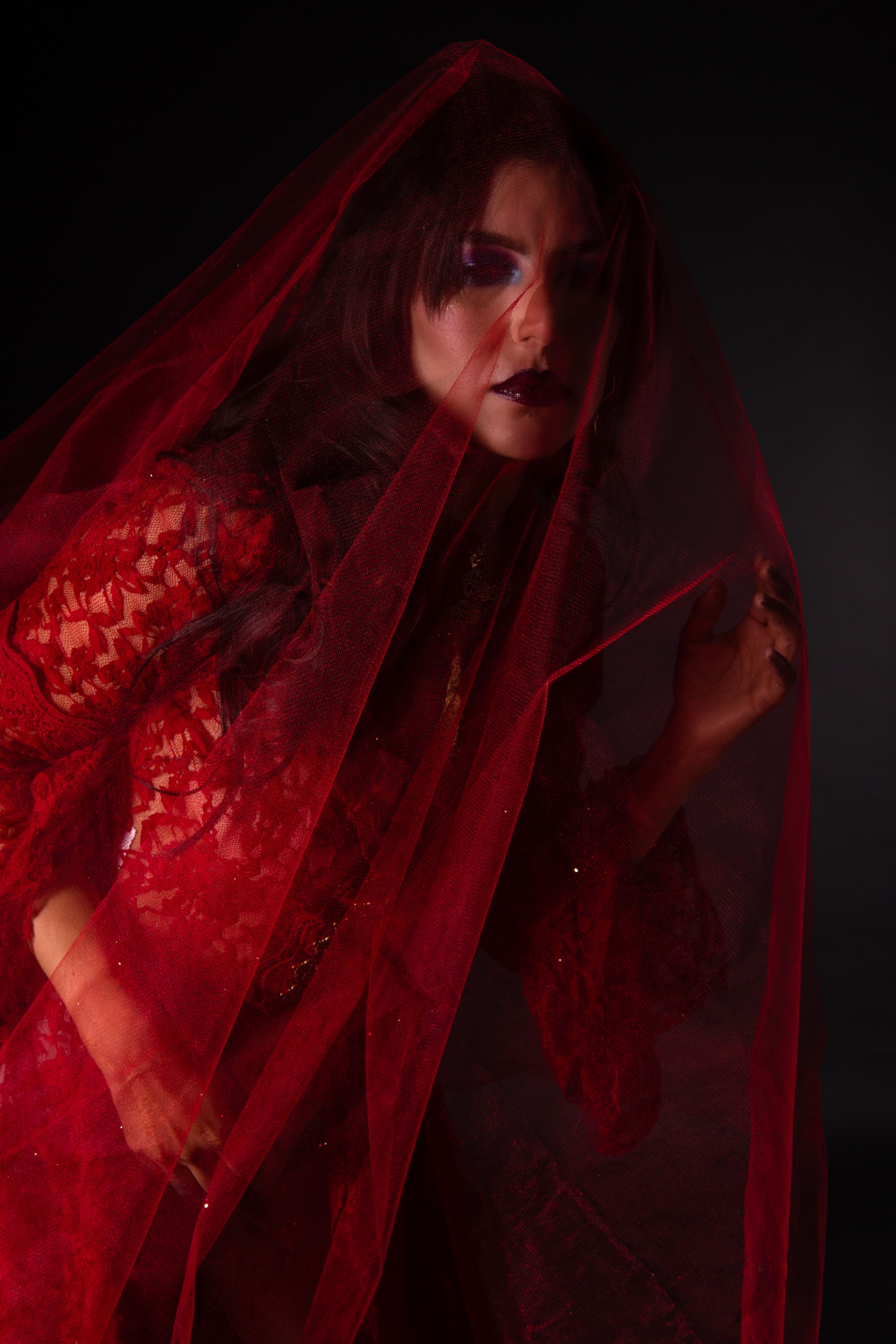 Dramatic Portrait of Woman in Red Veil · Free Stock Photo