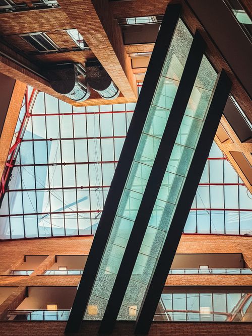 Free Interior view of a contemporary glass and brick atrium in Kermanshah, Iran. Stock Photo