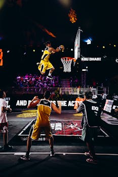 Stunning slam dunk during a high-energy basketball game in Abu Dhabi, showcasing athleticism and excitement.