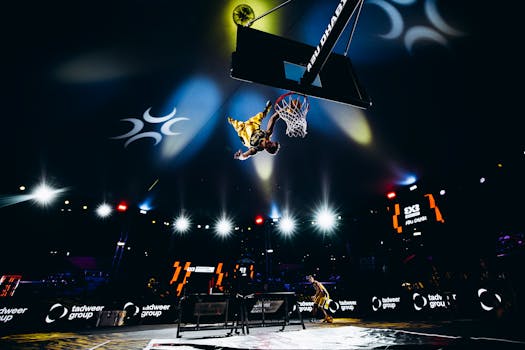 High-energy slam dunk action at a basketball game in Abu Dhabi, UAE.