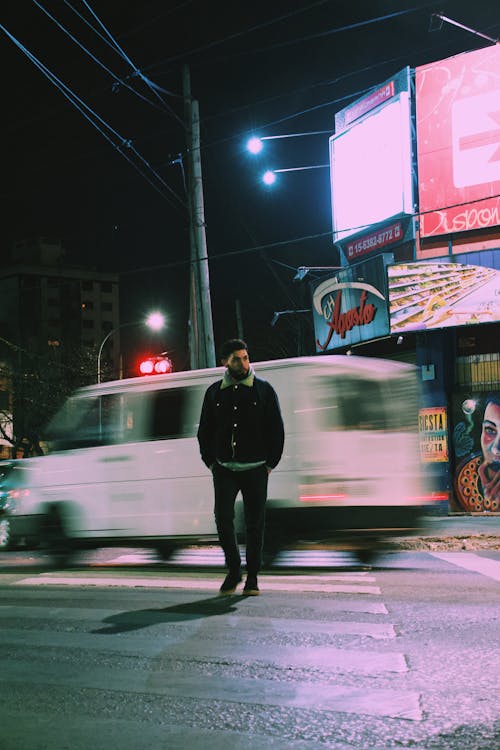 Man Walking on Pedestrian Crossing